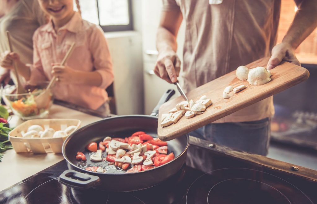 Fsamily cooking in their fully-equipped kitchen in Myrtle Beach, SC